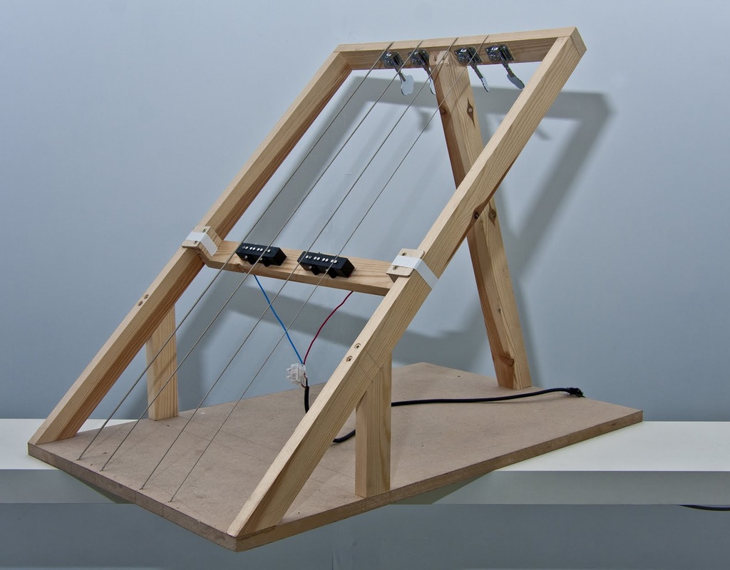 Experimental handmade string instrument with wooden frame and strings